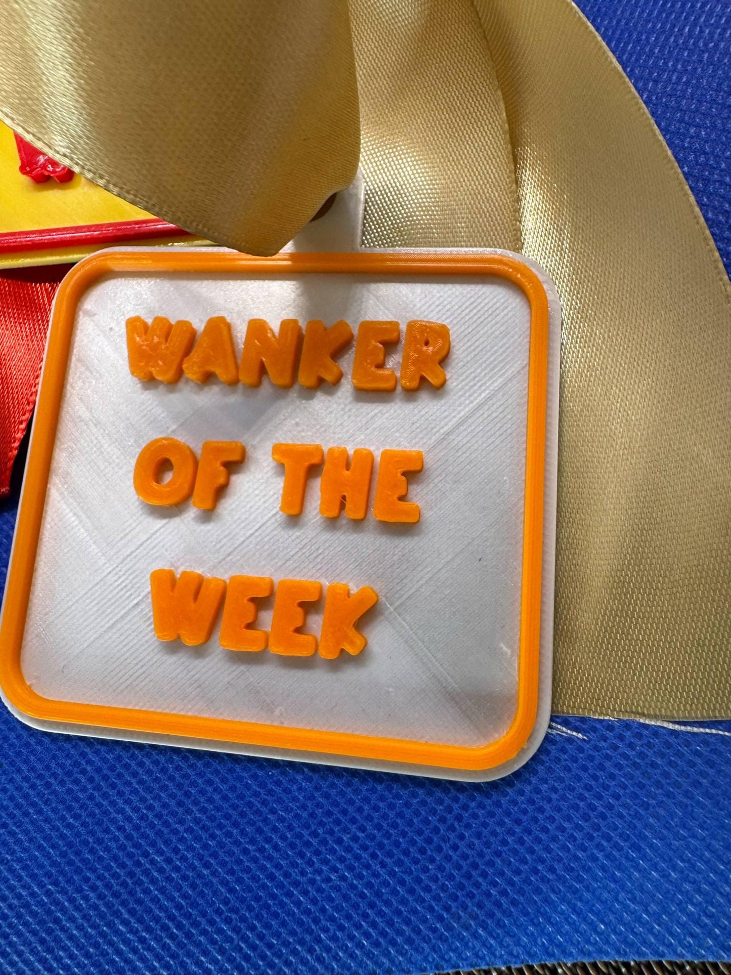 Cheeky 'W****R Of The Week' Medallion