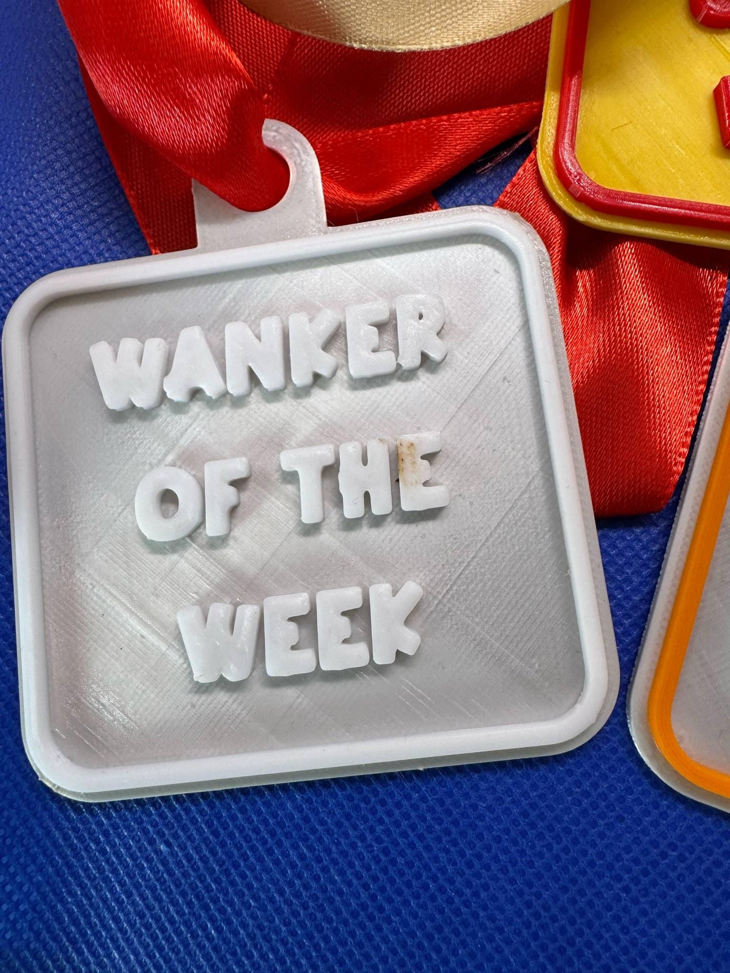 Cheeky 'W****R Of The Week' Medallion